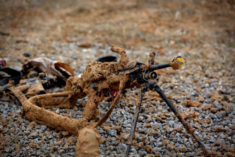 An M249 light machine gun sits, caked in mud, during skill level one task training, ahead of lanes training validation at the Army Reserve’s Combat Support Training Exercise 78-18-03, at Fort Knox, Kentucky, Mar. 20, 2018.