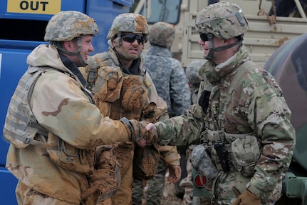 U.S. Army Reserve Soldiers, left, assigned to the 417th Quartermaster Company, based out of Scottsburg, Indiana, meet Army Reserve Maj. Gen. Chris Gentry, Deputy Commanding General (Support), First Army, ahead of their lanes training validation, during Combat Support Training Exercise 78-18-03, at Fort Knox, Kentucky, Mar. 20, 2018.