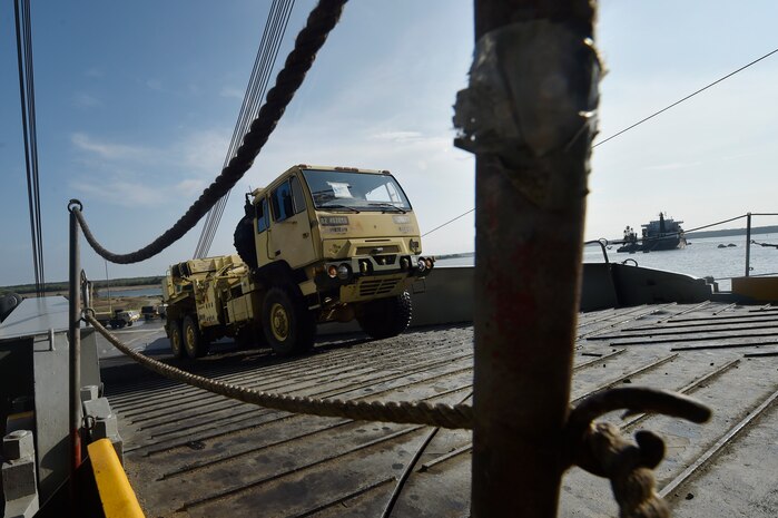 Vehicles assigned to the 82nd Airborne Division are loaded onto the USNS Watson (T-AKR-310) in preparation for transport at Joint Base Charleston’s - Weapons Station, S.C., March 20. The 841st Transportation Battalion, 597th Transportation Brigade, on-loaded more than 1,500 vehicles and equipment, including combat helicopters. Charleston has the capability to transport cargo by air, land, rail and sea.