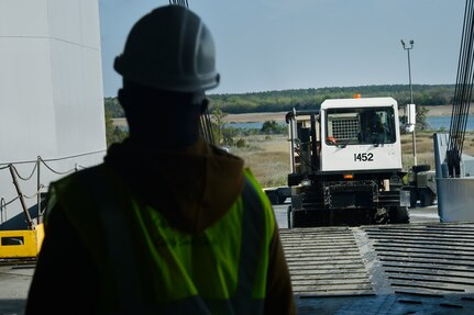 Vehicles assigned to the 82nd Airborne Division are loaded onto the USNS Watson (T-AKR-310) in preparation for transport at Joint Base Charleston’s - Weapons Station, S.C., March 20. The 841st Transportation Battalion, 597th Transportation Brigade, on-loaded more than 1,500 vehicles and equipment, including combat helicopters. Charleston has the capability to transport cargo by air, land, rail and sea.