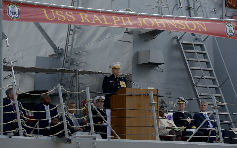U.S. Marine Corps Gen. Robert Neller, commandant of the Marine Corps, delivers remarks during the USS Ralph Johnson (DDG-114) commissioning ceremony March 24, 2018 at the Port of Charleston, S.C.