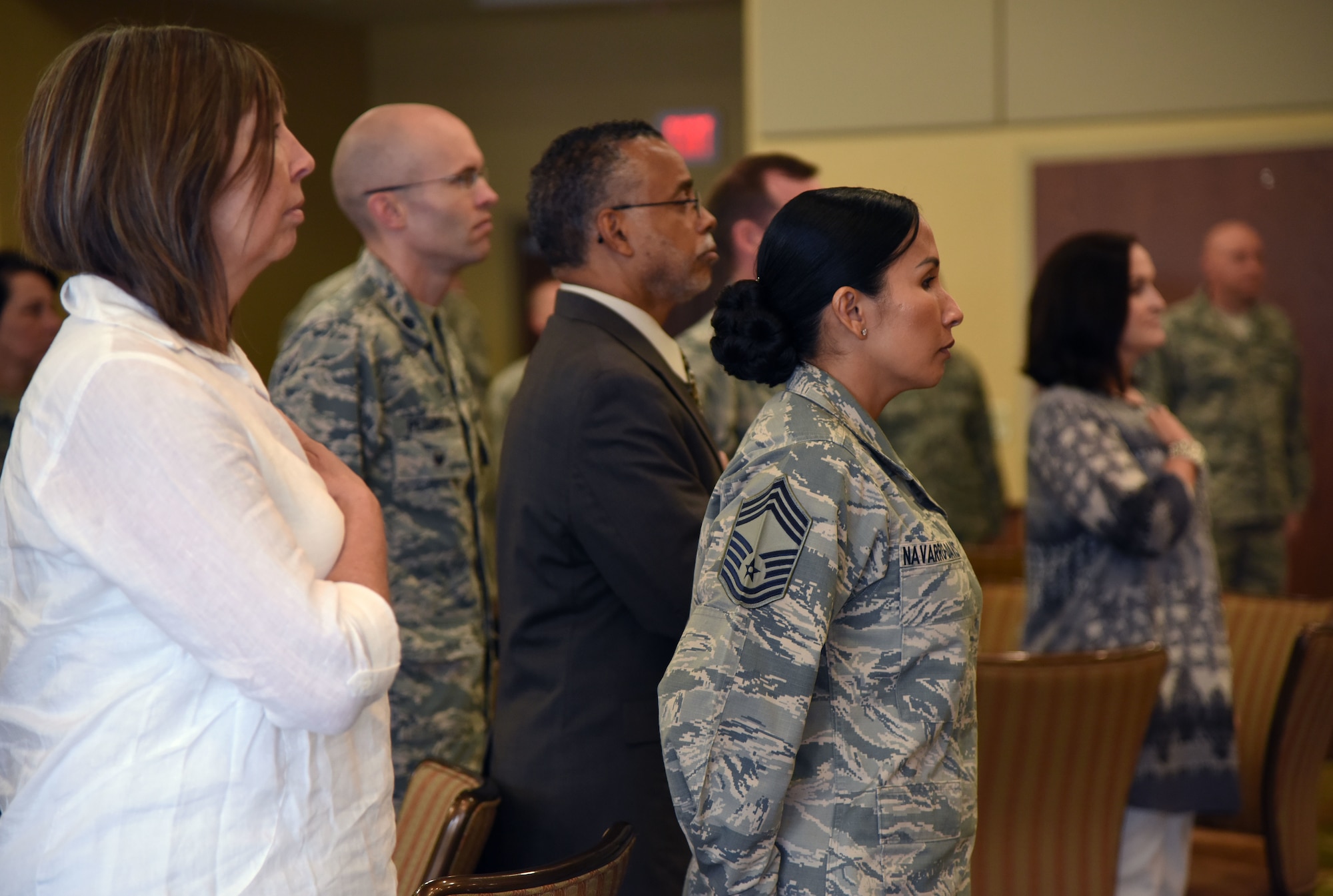 Keesler personnel stand during the singing of the national anthem during the Women’s History Month Luncheon at the Bay Breeze Event Center March 27, 2018, on Keesler Air Force Base, Mississippi. The theme for this year’s event is “Nevertheless She Persisted.” (U.S. Air Force photo by Kemberly Groue)