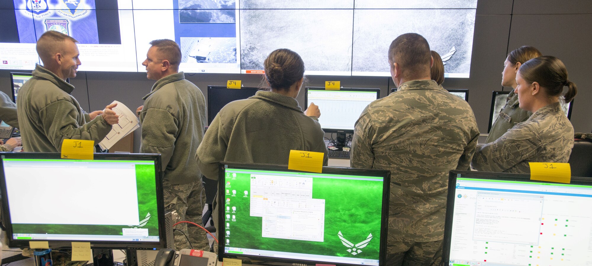 U.S. Airmen from the 9th Air Force discuss solutions to request manpower from the joint community to support a joint task force (JTF) during JTF-9 Staff Exercise 18-3 at Shaw Air Force Base, S.C., March 7, 2018.