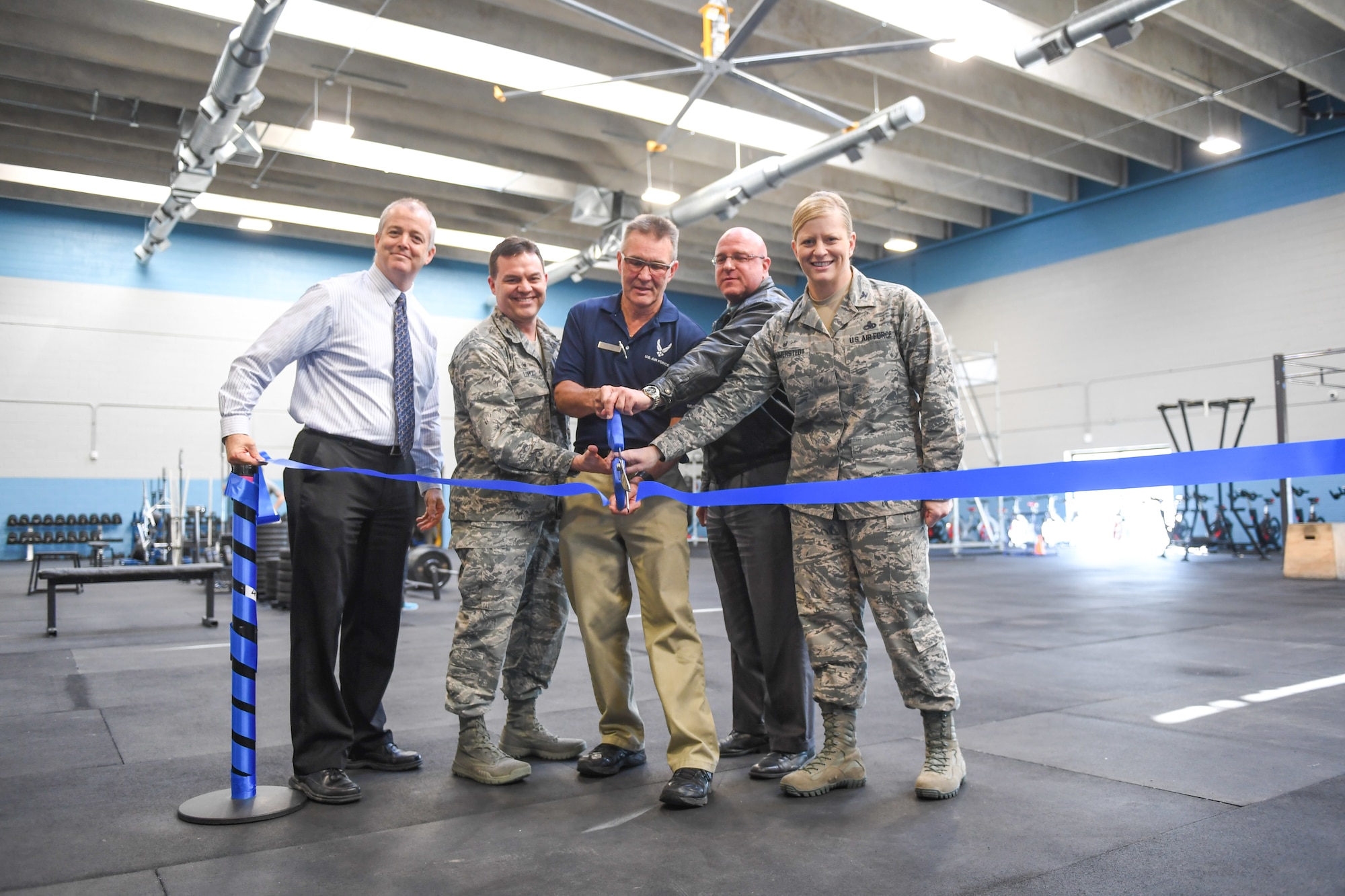 John Cullinane, 75th Force Support Squadron director, Col. Gabriel Lopez, 75th Mission Support Group commander, Jim Tyson, fitness director, Harry Briesmaster, 75th Civil Engineering Group director, and Col. Jennifer Hammerstedt, 75th Air Base Wing commander, cut the ceremonial ribbon March 27, 2018, to commemorate the grand opening of the Hess Fitness Center's functional training area at Hill Air Force Base, Utah. (U.S. Air Force photo by Cynthia Griggs)