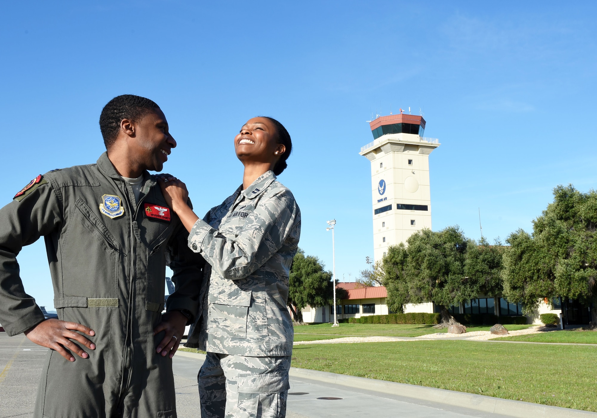 Capt. Aisha Lockett, 60th Air Mobility Wing executive officer, and Capt. Broderick Lockett, 21st Airlift Squadron director of staff, stand together on the flightline at Travis Air Force Base, California, Mar. 27. The Locketts have been at Travis since 2015 and, in that time, have contributed not only to the base's standard of living, but also to its history and legacy. (U.S. Air Force photo by Airman 1st Class Christian Conrad)