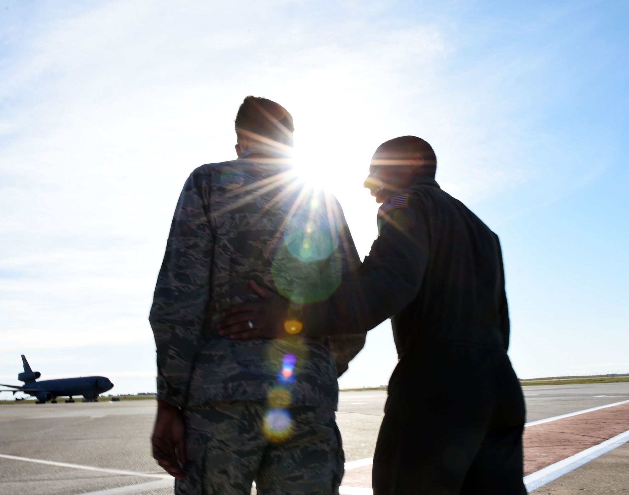 Capt. Aisha Lockett, 60th Air Mobility Wing executive officer, and Capt. Broderick Lockett, 21st Airlift Squadron director of staff, stand together on the flightline at Travis Air Force Base, California, Mar. 27. The Locketts have been at Travis since 2015 and, in that time, have contributed not only to the base's standard of living, but also to its history and legacy. (U.S. Air Force photo by Airman 1st Class Christian Conrad)