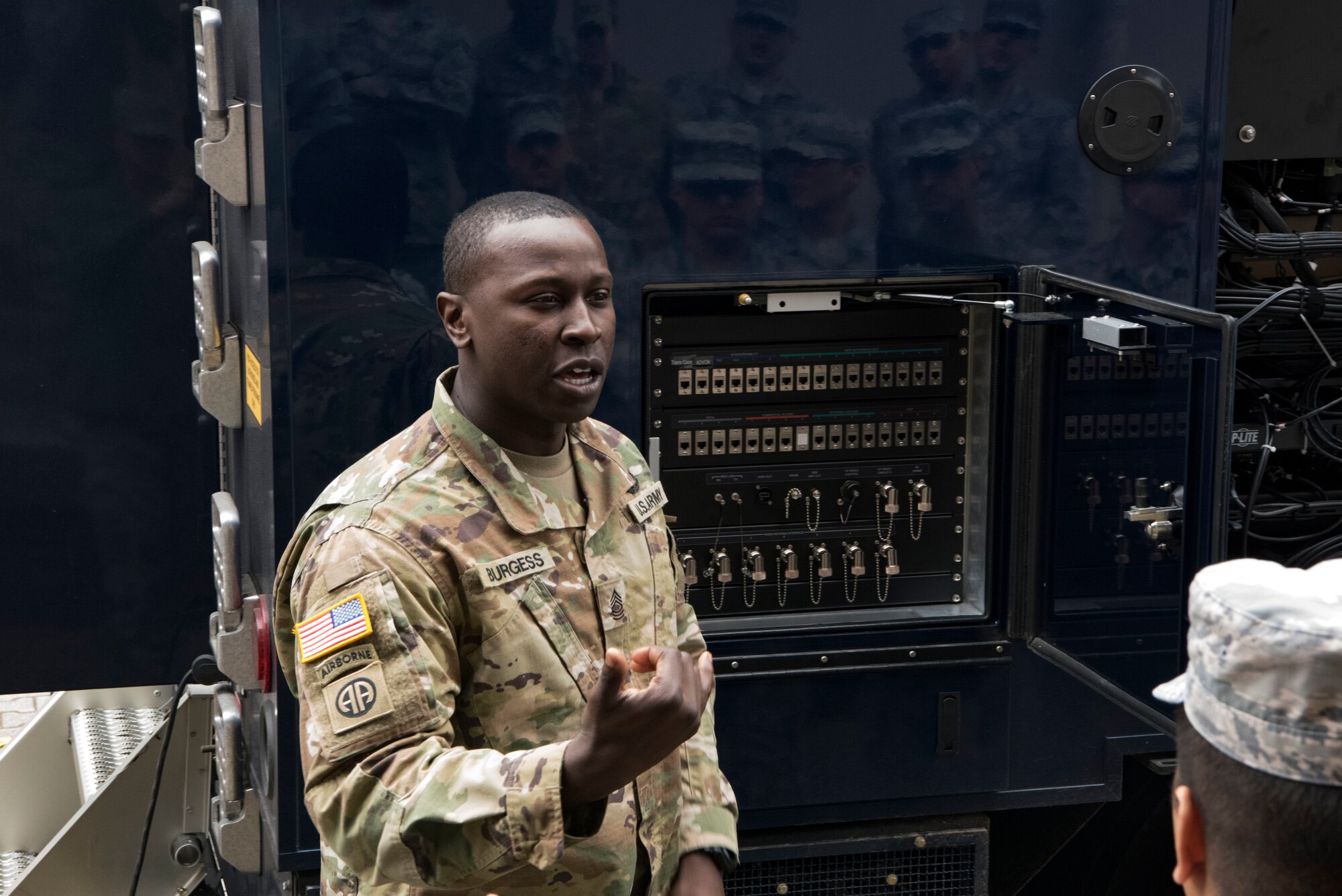 U.S. Army Master Sgt. Desmond Burgess, 773rd Civil Support Team communications chief, briefs U.S. Airmen and U.S. Army Reserve personnel about the Unified Command Suite during the 786th Civil Engineer Squadron and 773rd Civil Support Team interoperability demonstration on Ramstein Air Base, Germany, March 12, 2018. The vehicle provides secure and non-secure phone and internet services to other agencies on the scene.