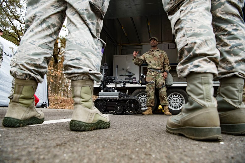 U.S. Army Cpl. Jonathan Bodyen, 773rd Civil Support Team survey team member, describes how the Talon IV is used during the 786th Civil Engineer Squadron and 773rd Civil Support Team interoperability demonstration on Ramstein Air Base, Germany, March 12, 2018. The Talon IV is a robot used to scout unknown areas due to its ability to detect potentially dangerous chemicals and is equipped with cameras that obtain a visual on the point of interest without putting lives in danger.
