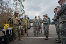 U.S. Army Cpl. Jonathan Bodyen, 773rd Civil Support Team survey team member, displays a portable explosives detector to Airmen at the 786th Civil Engineer Squadron and 773rd Civil Support Team interoperability demonstration on Ramstein Air Base, Germany, March 12, 2018. The purpose of the demonstration was to further expand joint relations and discover potential gaps in capability.