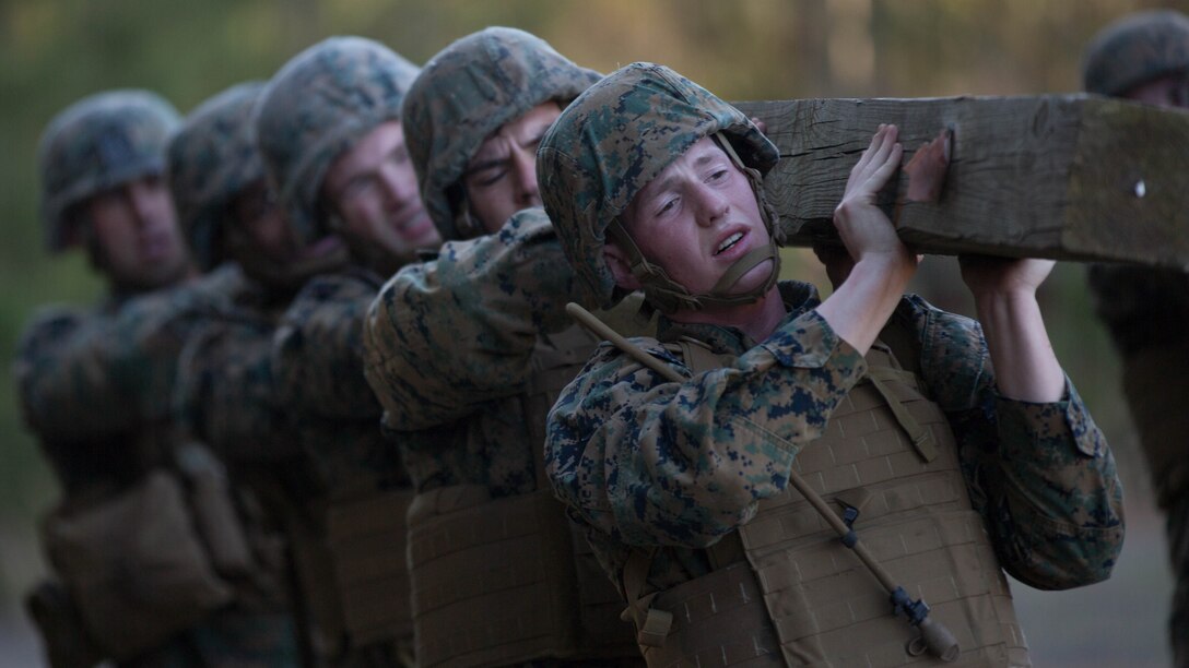 U.S. Marines with 8th Marine Regiment, 2nd Marine Division execute log-lifts as part of combat conditioning exercises on Camp Lejeune, N.C., March 23, 2018. The Marines performed the exercises to improve upon both their physical and mental strength.