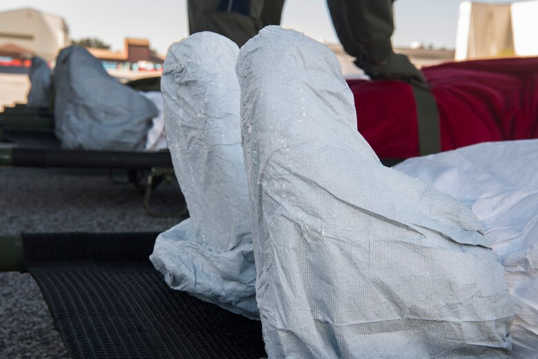 Patient role-players are prepped during a transportable isolation system training and research event at Joint Base Charleston, S.C., March. 14, 2018.