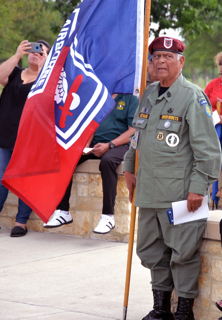 A retired Army Special Force sergeant major stands at attention during the National Anthem at the 50th Anniversary of the Commemoration of the Vietnam War at the Fort Sam Houston National Cemetery March 27.