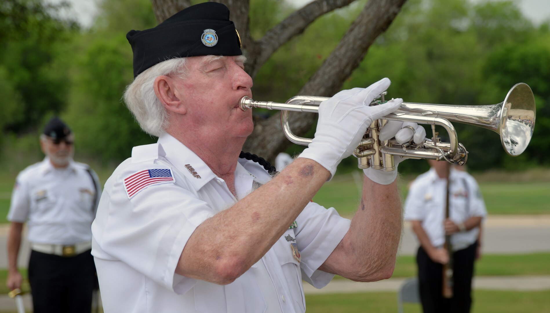 A member of the Fort Sam Houston Memorial Services Detachment plays "Taps" near the end of the ceremony for the 50th Anniversary of the Commemoration of the Vietnam War at the Fort Sam Houston National Cemetery March 27.