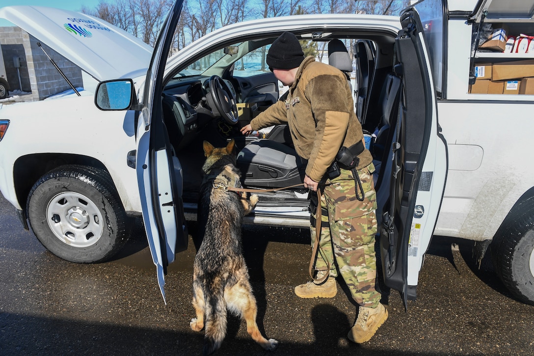 Air Force Staff Sgt. Heather Johnson works with her military working dog.