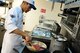 Airman 1st Class Xavier Wajid, 341st Force Support Squadron food services apprentice, browns ground beef for a lunch menu at the Grizzly Bend Mar. 7, 2018, at Malmstrom Air Force Base, Mont.