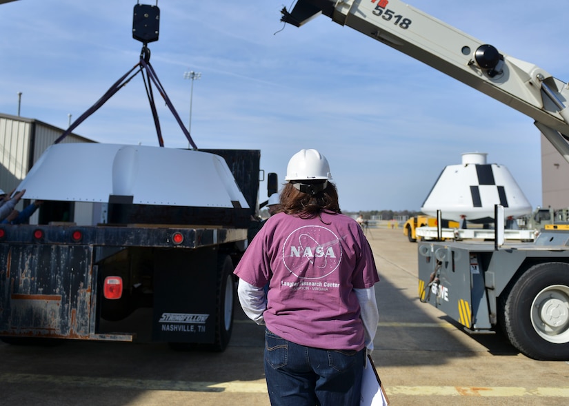 A NASA employee oversees transport preparation for the NASA Orion crew module at Joint Base Langley-Eustis, Virginia, Feb. 9, 2018.