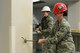 Col. Donna Pike, right, Air Force Global Strike Command A1 director, and Maj. Samantha Miller, 341st Force Support Squadron commander, break down drywall at the Elkhorn Dining Facility Feb. 27, 2018, at Malmstrom Air Force Base, Mont.