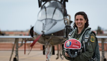 U.S. Air Force Lt. Col. Cheryl Buehn, 71st Fighter Training Squadron T-38A Talon nstructor pilot, poses in front of T-38A Talons at Joint Base Langley-Eustis, Virginia, March 27, 2018.