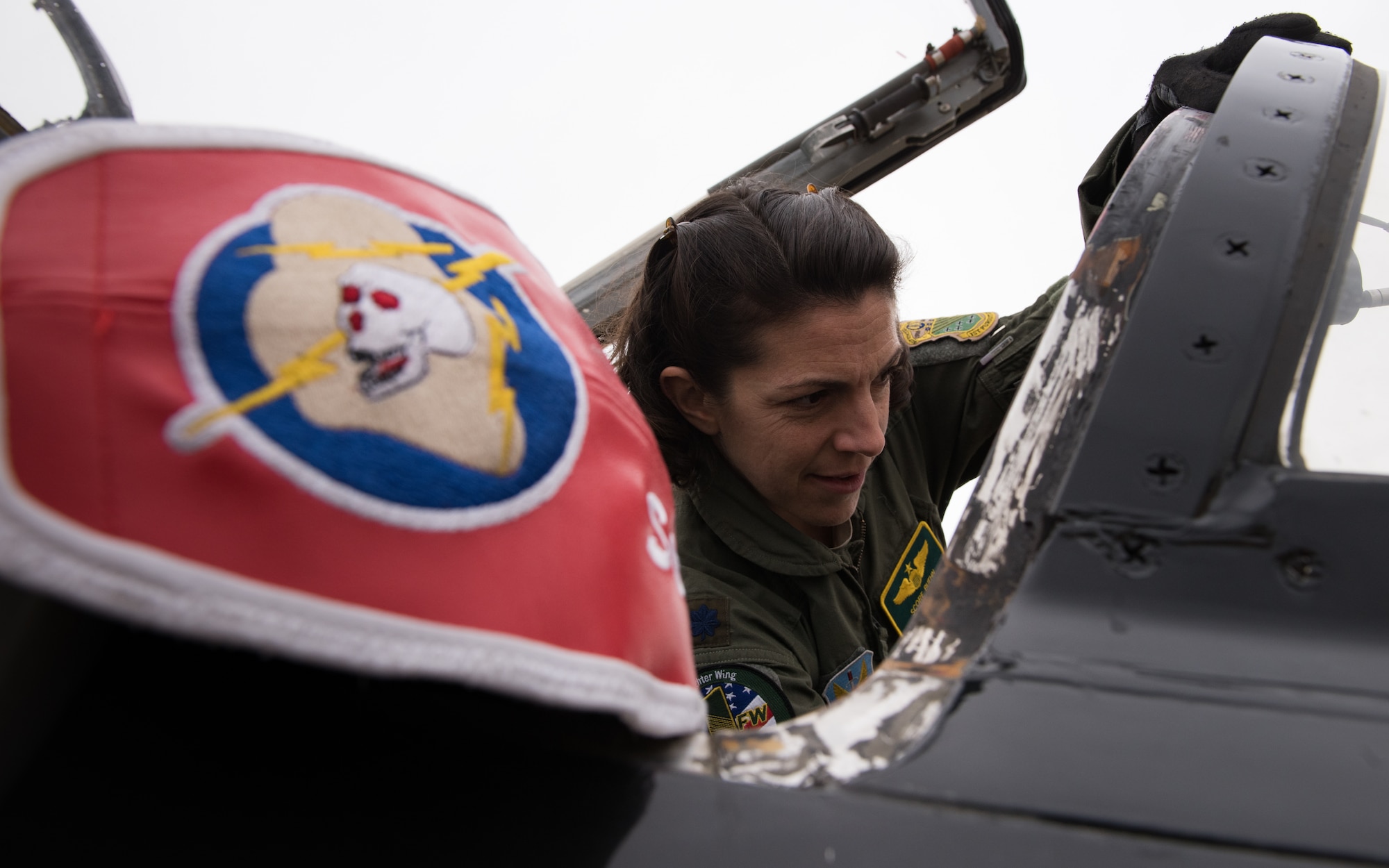 U.S. Air Force Lt. Col. Cheryl Buehn, 71st Fighter Training Squadron T-38A Talon nstructor pilot, poses in front of T-38A Talons at Joint Base Langley-Eustis, Virginia, March 27, 2018.