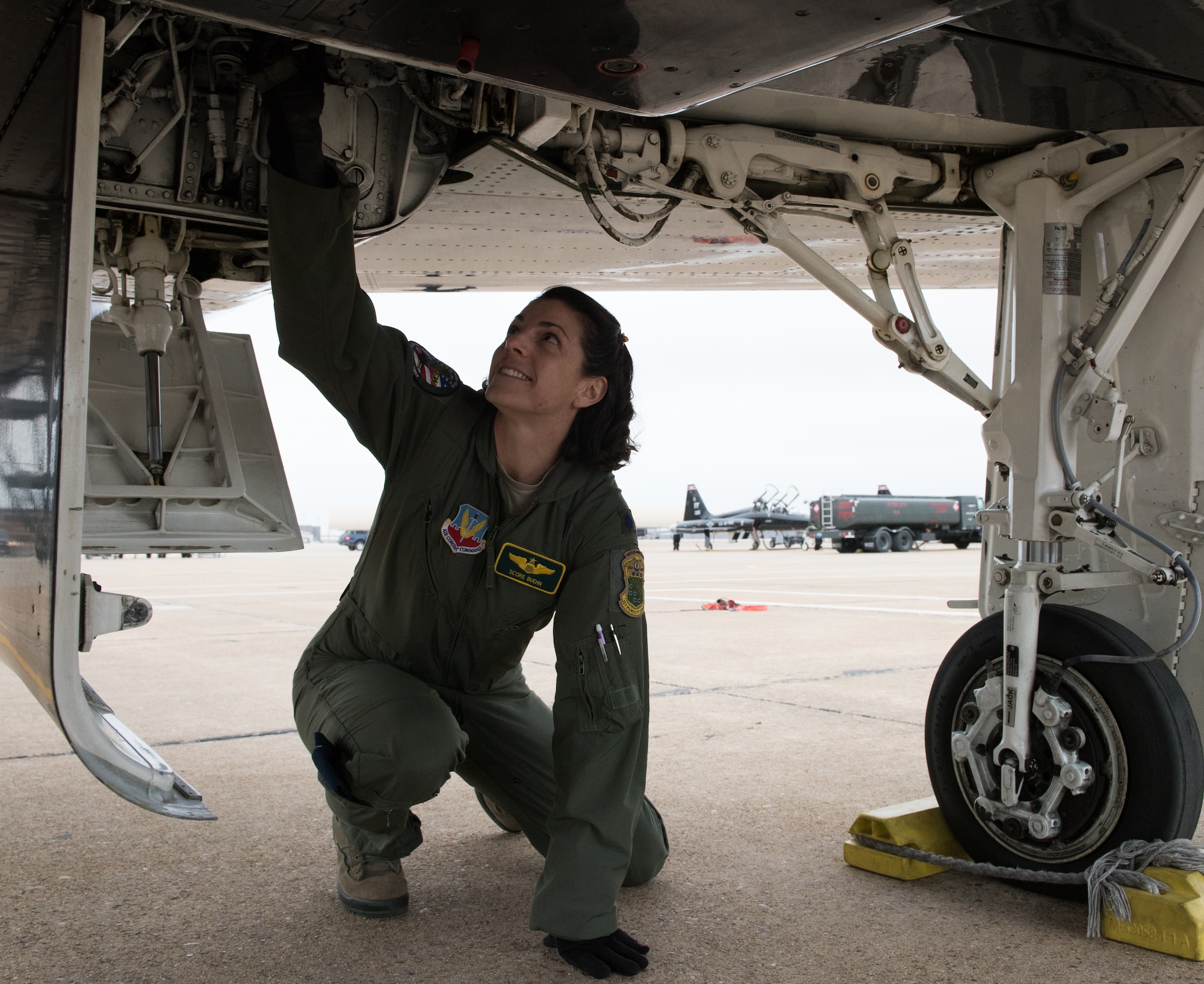 U.S Air Force Lt. Col. Cheryl Buehn, 71st Fighter Training Squadron T-38A Talon instructor pilot, performs preflight inspections on a T-38A Talon at Joint Base Langley-Eustis, Virginia, March 27, 2018