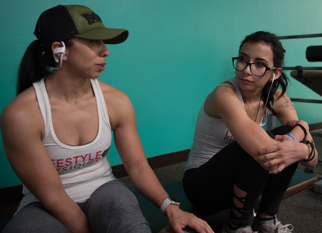 SSgt. Anna Solis, Security Forces here, takes a break from her exercises with her daughter, Emily Ibarra, Mar. 13, 2018 at the Lohse Family YMCA. Solis and Ibarra said the experience of training together for the competition has brought them closer. (U.S. Air National Guard photo by Senior Airman David English)