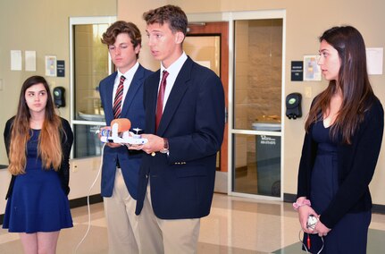 Team Narwhals of East View High School briefs Navy and civilian judges on the build of their underwater remotely operated vehicle, or ROV, during the Georgetown SeaPerch Underwater Robotics Challenge Regional Competition held at the Georgetown Recreation Center. Navy Recruiting Command Southwest Region City Outreach Program, in cooperation with the Georgetown Independent School District and NRD San Antonio, hosted the regional qualifier. The competition consisted of three evolutions: speed obstacle course, challenge course, and interview/presentation.