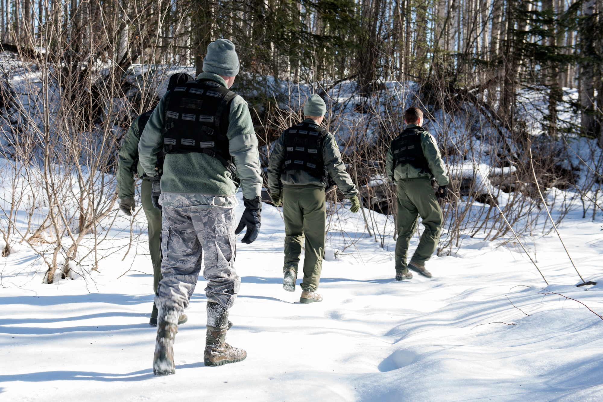 Aircrew members participate in a combat-survival refresher course at Joint Base Elmendorf-Richardson, Alaska, March 22, 2018. The course consisted of hands-on learning with survival equipment, land navigation, evasion and escape tactics, recovery procedures and communication. Equipment included flares, compasses and radios.