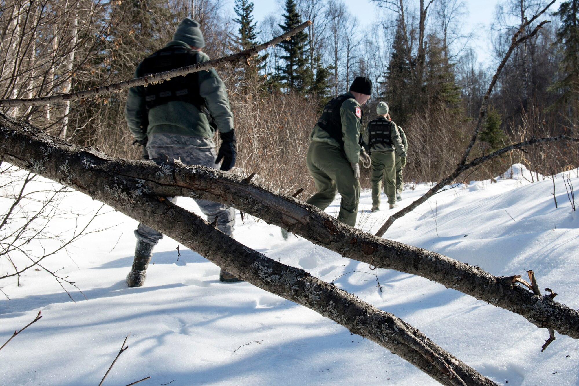 Aircrew members participate in a combat-survival refresher course at Joint Base Elmendorf-Richardson, Alaska, March 22, 2018. The course consisted of hands-on learning with survival equipment, land navigation, evasion and escape tactics, recovery procedures and communication. Equipment included flares, compasses and radios.