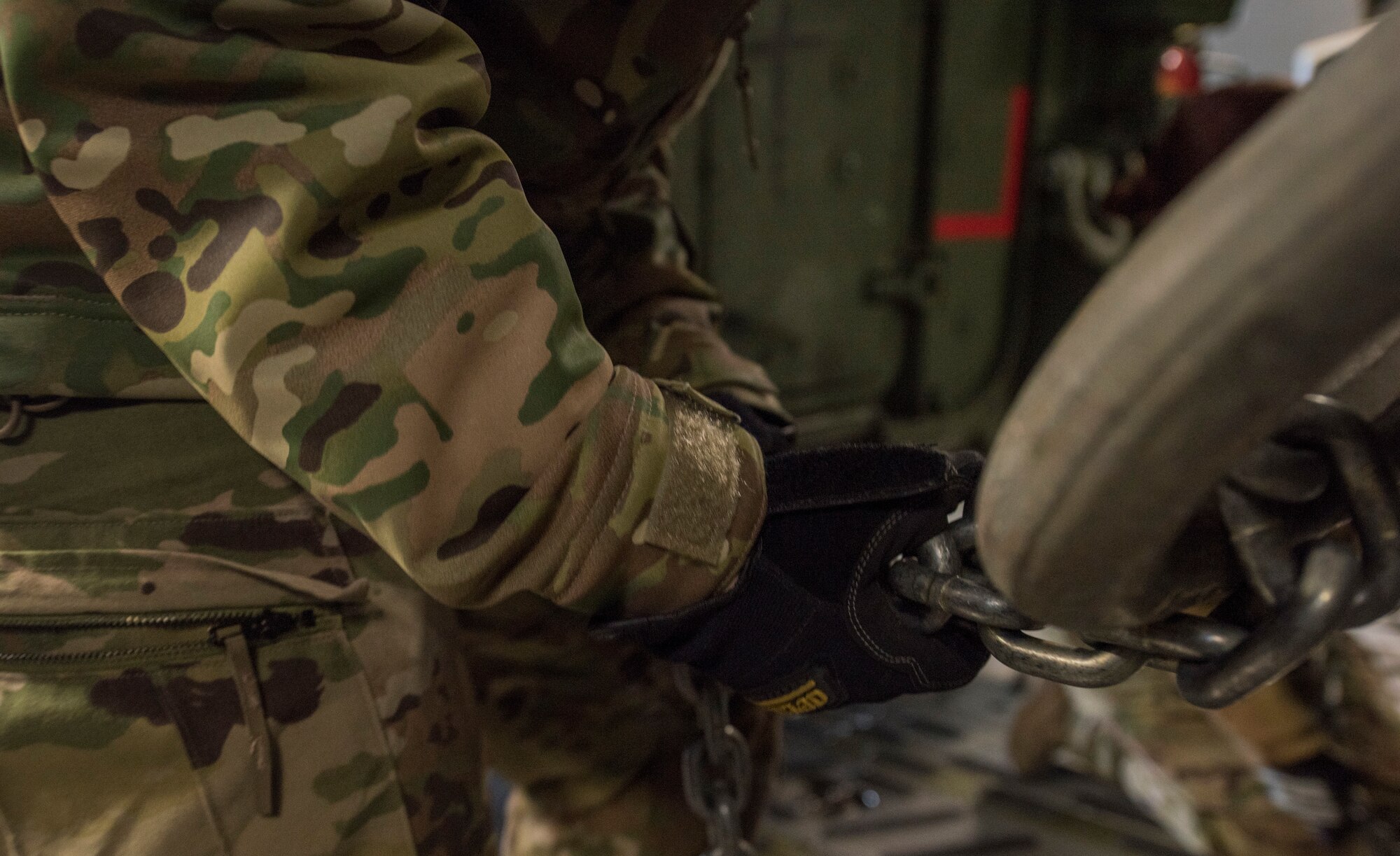 U.S. Air Force Airman 1st Class Samantha Martino, 7th Airlift Squadron loadmaster, secures a U.S. Army Interim Armored Vehicle Stryker inside a C-17 Globemaster III during Exercise Artic Pegasus at Eielson Air Force Base, Alaska, March 11, 2018. For the exercise the Air Force picked up and delivered Army Soldiers and Strykers to Deadhorse, Alaska, to practice cold-weather operations. (U.S. Air Force photo by Senior Airman Tryphena Mayhugh)