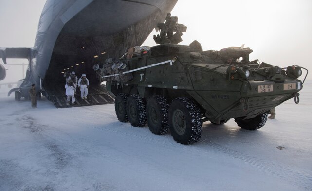 U.S. Soldiers and an Interim Armored Vehicle Stryker exit a C-17 Globemaster III during Exercise Arctic Pegasus at Deadhorse, Alaska, March 13, 2018. The exercise tested the Air Force and Army’s ability to operate in cold weather. (U.S. Air Force photo by Senior Airman Tryphena Mayhugh)