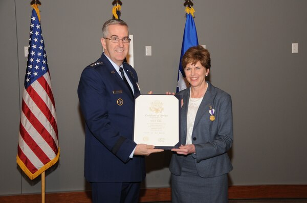 U.S. Air Force Gen. John Hyten, commander of U.S. Strategic Command (USSTRATCOM), presents a certificate of service to Kerry Kelley during her retirement ceremony at the new USSTRATCOM command and control facility at Offutt Air Force Base, Neb., March 9, 2018. Kelley was recognized for her 32 years of civil service with Strategic Air Command and USSTRATCOM. She will continue to serve as USSTRATCOM director of Command and Control, Communications, Computer (C4) Systems; chief information officer; and director of the Joint Cyber Center until her official retirement date of March 31, 2018. 
USSTRATCOM has global responsibilities assigned through the Unified Command Plan that include strategic deterrence, nuclear operations, space operations, cyberspace operations, joint electromagnetic spectrum operations, global strike, missile defense, and analysis and targeting.