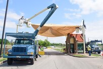 A 502nd Civil Engineer squadron high voltage team re-attaches th