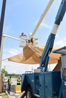 A 502nd Civil Engineer squadron high voltage team re-attaches the cover at medina base gate