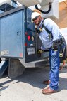 A 502nd Civil Engineer squadron high voltage team re-attaches the cover at medina base gate