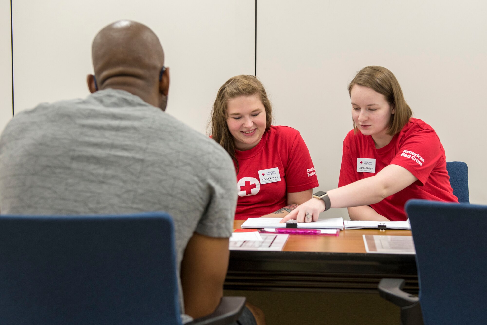 Senior Airman Ryan Higgins Dodd, 374th Logistics Readiness Squadron fuels distribution operator, answers questions as part of a medical prescreening prior to donating blood to the Japanese Red Cross Society at Yokota Air Base, Japan, March 28, 2018.