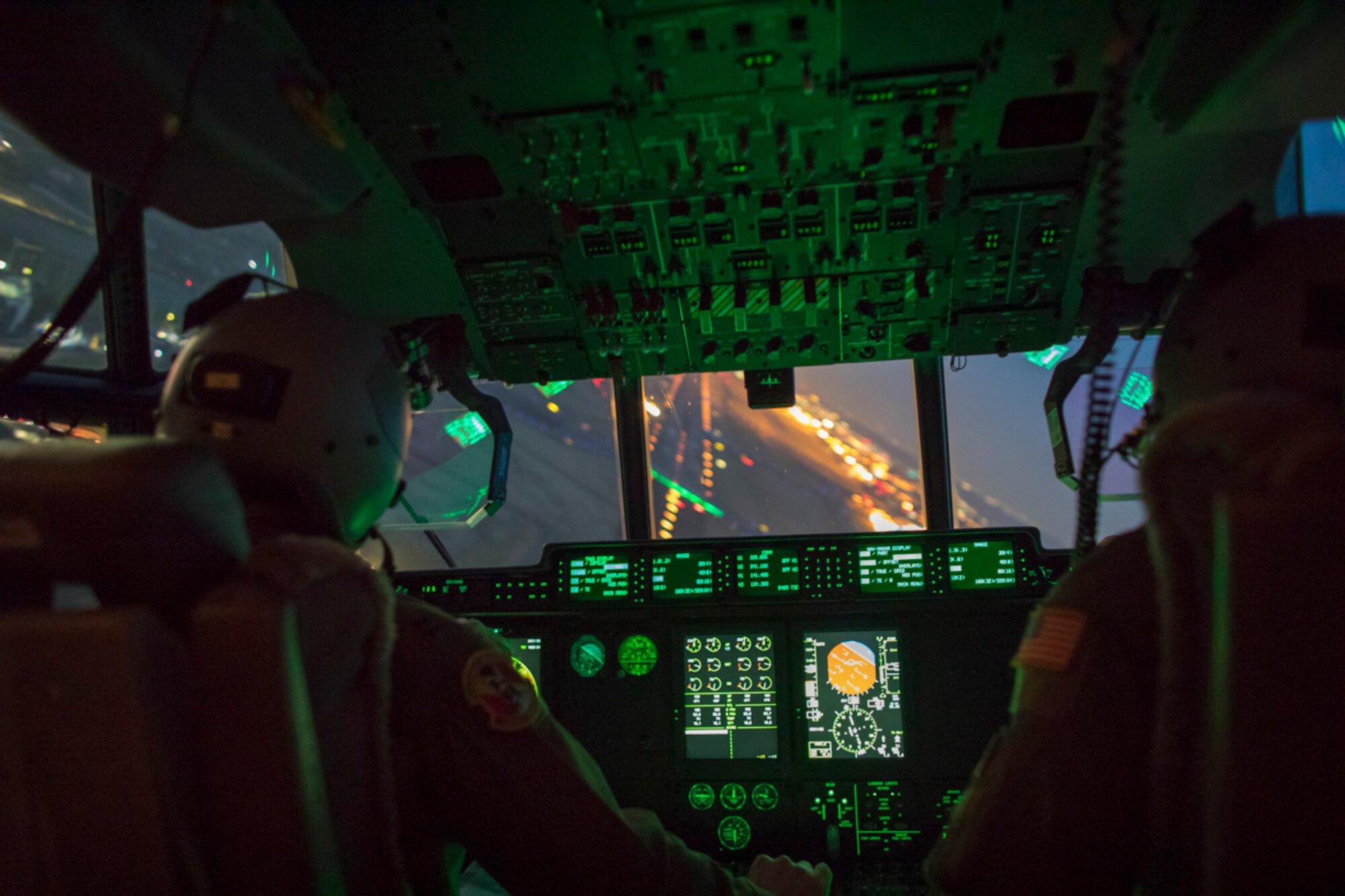 Capt. Andrew Huddleston and Maj. Christopher Carlen, both 36th Airlift Squadron C-130J pilots, approach a runway in a C-130J Super Hercules