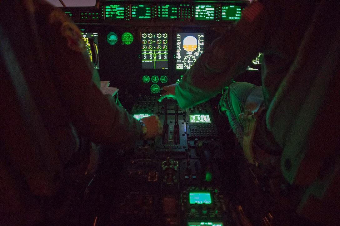 Capt. Andrew Huddleston and Maj. Christopher Carlen, the 36th Airlift Squadron C-130J pilots, approve the runway in a C-130J Super Hercules