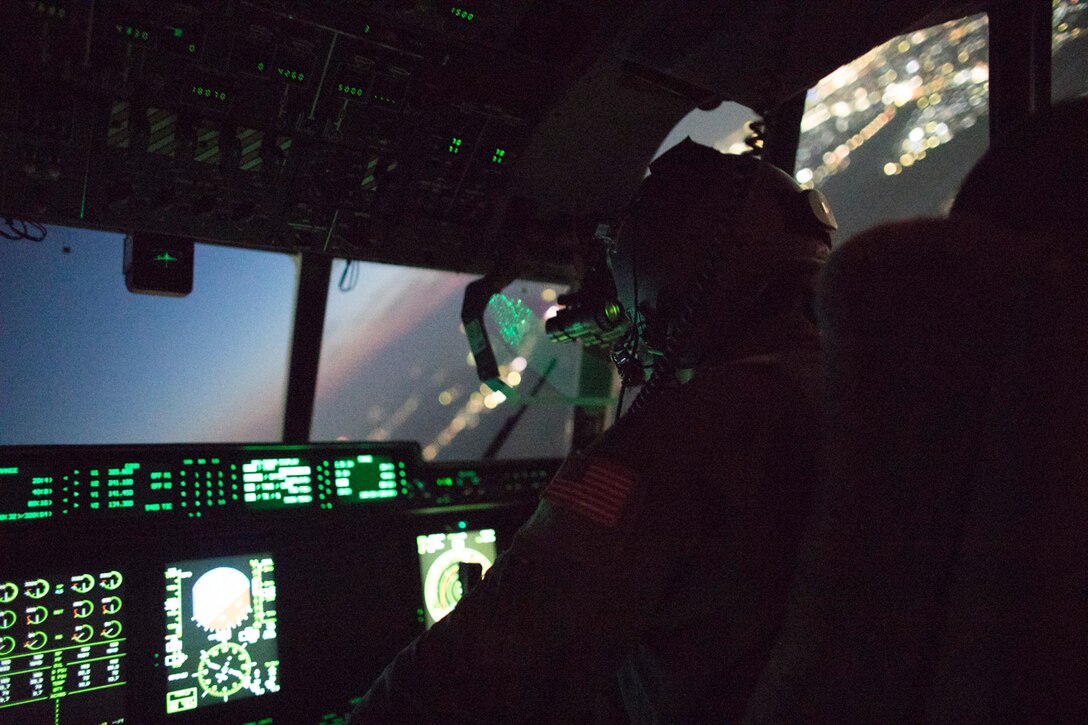 Maj. Christopher Carlen, 36th Airlift Squadron C-130j pilot, wears night vision goggle during a training mission above Yokota Air Base