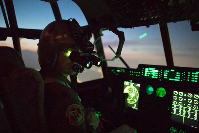 Capt. Andrew Huddleston, 36th Airlift Squadron C-130J pilot, wears night vision goggle during a training mission
