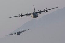 Two Air Force C-130J Super Hercules assigned to the 36th Airlift Squadron fly over Sizuoka prefecture, Japan, March 26, 2018