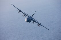 A U.S. Air Force C-130J Super Hercules assigned to the 36th Airlift Squadron flies near Suruga Bay