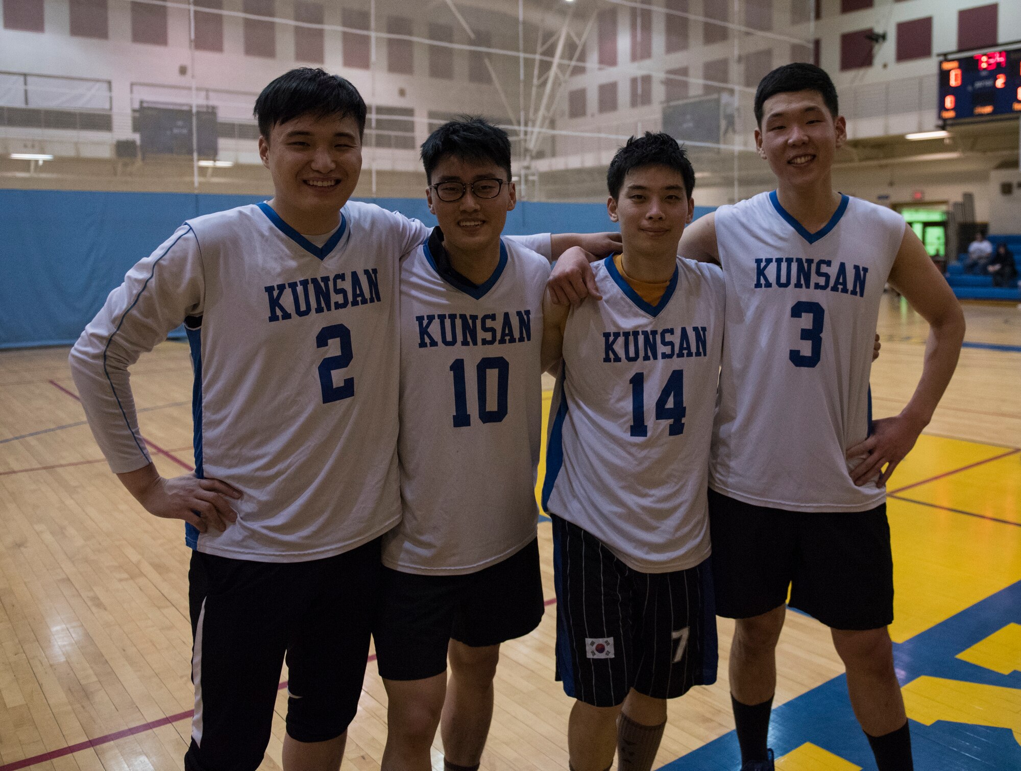 Four Republic of Korea Air Force Airmen pose for a photo after a game of basketball during an intramural sporting event January 22, 2018, at Kunsan Air Base, Republic of Korea. Kunsan Air Base’s intramural basketball season just recently wrapped up and this season marked the first time members of the ROKAF have participated in the Wolf Pack’s unit versus unit competition. (U.S. Air Force photo by Tech. Sgt. Josh Rosales)