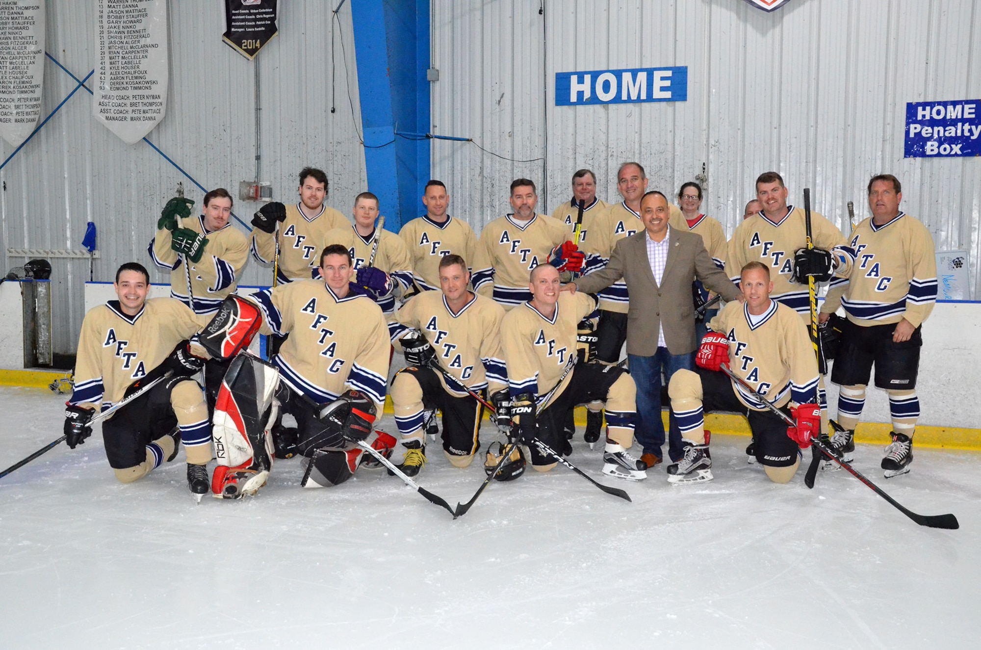 Rob Medina, Director of Community Relations for Congressman Bill Posey (FL-15), poses with members of the Athletes for Teamwork and Charity hockey team March 24, 2018.  The team is comprised of members of the Air Force Technical Applications Center at Patrick AFB, Fla.  Medina presented Certifications of Recognition to the Airmen on behalf of Posey to recognize their service and charitable efforts in the community.  The team faced off against players from Florida Tech at the Space Coast IcePlex in Rockledge, Fla. (U.S. Air Force photo by Susan A. Romano)