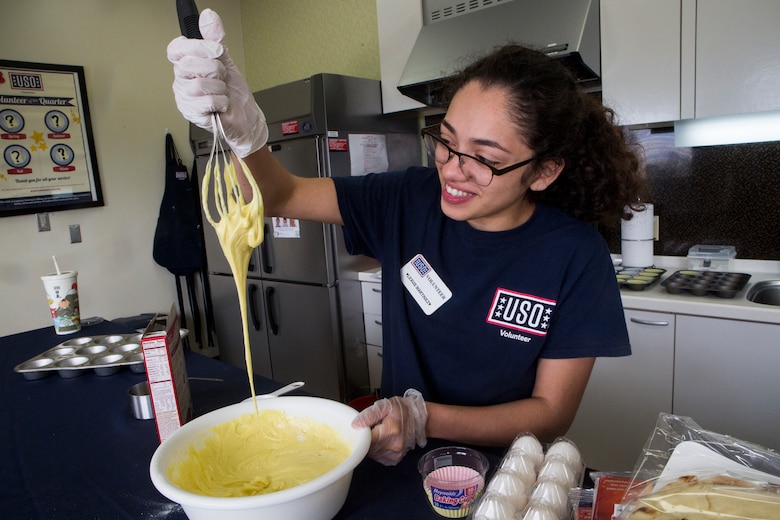 Cpl. Lexus Martinez, Marine Corps Installations Pacific Food Service Specialist of the Quarter, prepares to serve chow.