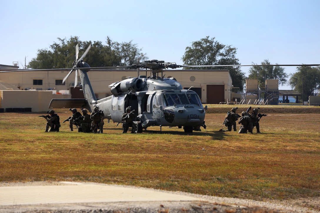 U.S. troops and British marines establish perimeter security.