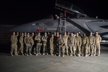 Members of 336th Expeditionary Fighter Squadron, 332nd Air Expeditionary Wing leadership and Lt. Col. Trinidad “Moses” Meza, 336th EFS deputy operations group commander and weapons system officer, pose for a group photo March 21, 2018, at an undisclosed location in Southwest Asia.