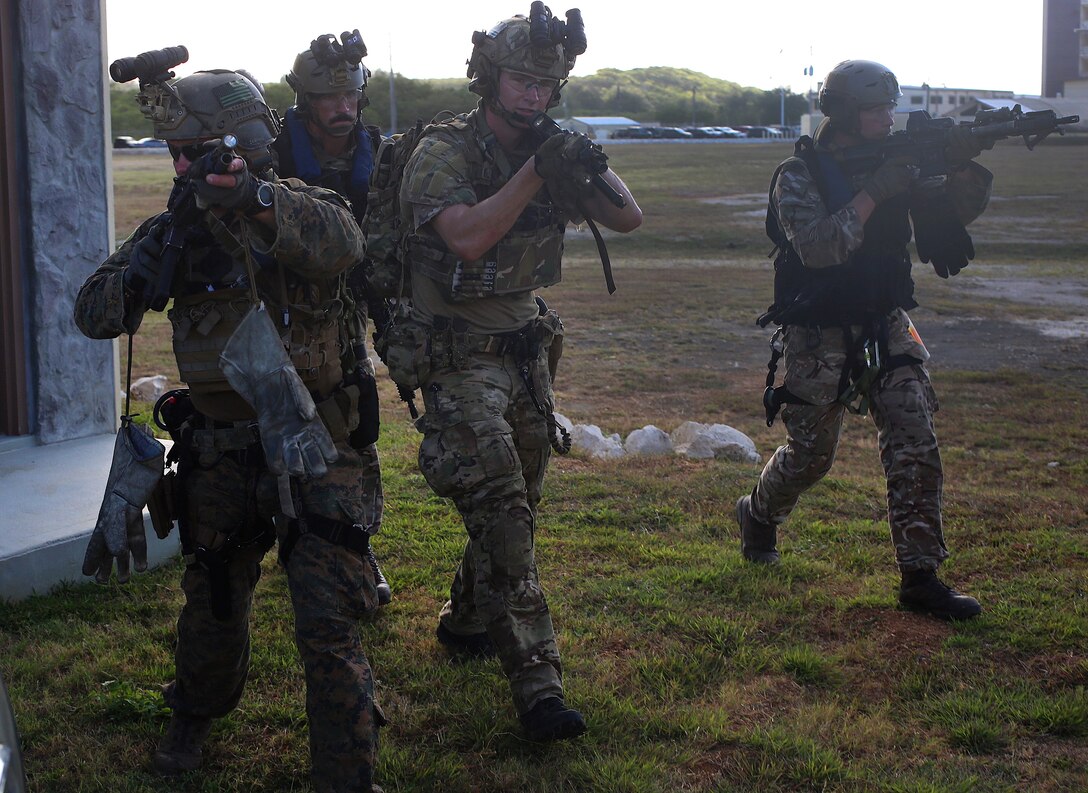 U.S. Marines, sailors and British marines provide security.