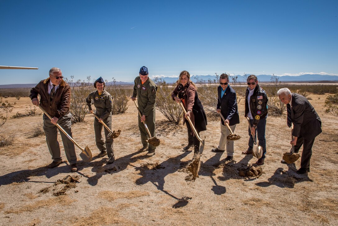 From left to right: George Welsh, Air Force Flight Test Museum curator; Col. Angela Suplisson, Air Force Test Center vice commander; Col. Jason Schott, 412th Test Wing vice commander; Lisa Gray, Flight Test Historical Foundation chairwoman; U.S. Congressman Steve Knight; Mark “Forger” Stucky and Dr. Keith Jaimeson, officially break ground on the construction of the new Air Force Flight Test Museum located just outside the West Gate of Edwards Air Force Base March 23. The museum will preserve Edwards AFB's rich legacy that started with the first time a sonic boom was heard in the valley 70 years ago. (U.S. Air Force photo by Matt Williams)