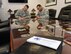Col. Houston Cantwell, 49th Wing commander, and Chief Master Sgt. Barrington Bartlett, 49th Wing command chief, sign up to make a donation to the Air Force Assistance Fund at Holloman Air Force Base, N.M., March 26, 2018. The four charities that are involved in AFAF are the Air Force Aid Society, General and Mrs. Curtis E. LeMay Foundation, the Air Force Villages, and the Air Force Enlisted Village. (U.S. Air Force photo by Staff Sgt. Timothy Young)