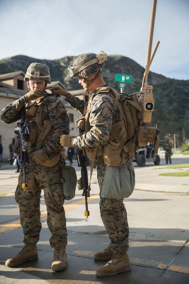 A Marine with Kilo Company, 3rd Battalion, 4th Regiment, 1st Marine Division, carries a new concept radio communication system during Urban Advanced Naval Technologies Exercise 2018 (ANTX18), March 21, 2018. Urban ANTX18 is an innovative approach to concept of operations and capability development that integrates engineers, technologists and operators into a dynamic development team. (U.S. Marine Corps photo by Lance Cpl. Robert Alejandre)